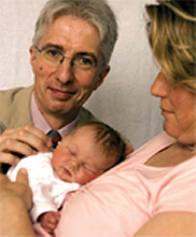 Professor Colin Kennedy and a mother and baby in the study